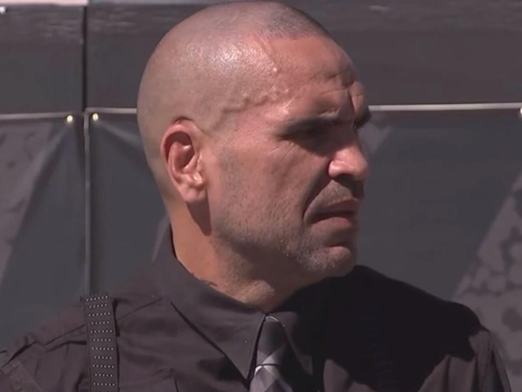 Anthony Mundine is surprised after being told there's someone on the phone.