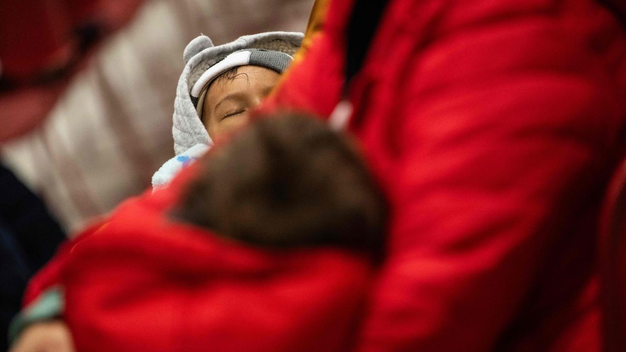 A boy sleeps during a presentation on immigration enforcement. Picture: Andrew Caballero-Reynolds/AFP