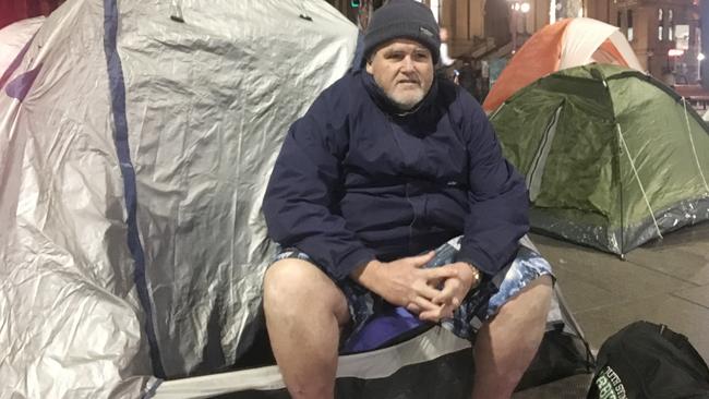 Wayne Grice outside his tent, just metres from the NSW Parliament, in Sydney’s Martin Place makeshift camp. Picture: Benedict Brook.