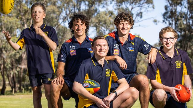 Crows players Will Hamill and Jordan Butts with students Declan, Lachlan (centre) and Alex at Renmark High School in late 2022. Picture: Tom Huntley