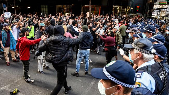 Police try to steer protesters away during the controversial rally in July. Picture: NCA NewsWire/Flavio Brancaleone