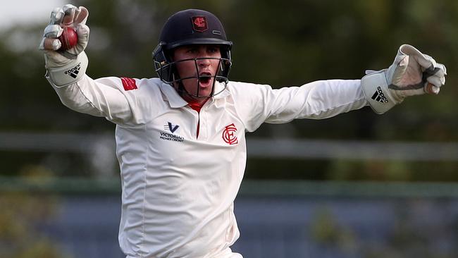 Isaac Conway appeals for a catch during his time at Essendon.