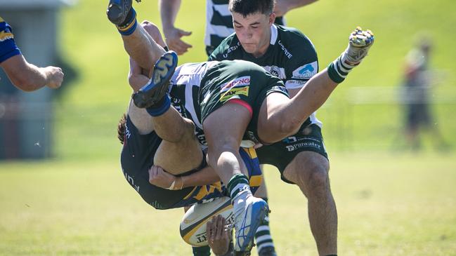 Sydney Uni player Dane Mitchell gets up-ended. Pictures: Julian Andrews