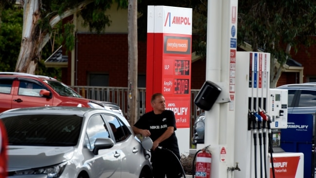 A motorist fills up at a petrol station at Point Cook as fuel passes $2 per litre. Picture: NCA NewsWire / Andrew Henshaw