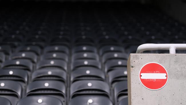 NEWCASTLE UPON TYNE, ENGLAND - JULY 26: A detail view of a "no entry" sign in the stands during the Premier League match between Newcastle United and Liverpool FC at St. James Park on July 26, 2020 in Newcastle upon Tyne, England. Football Stadiums around Europe remain empty due to the Coronavirus Pandemic as Government social distancing laws prohibit fans inside venues resulting in all fixtures being played behind closed doors. (Photo by Laurence Griffiths/Getty Images)