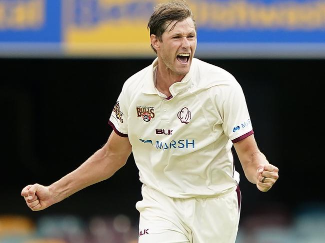 Bulls bowler Cameron Gannon celebrates dismissing Bushrangers player Peter Handscomb for 2 runs on day 2 of the Marsh Sheffield Shield match between the Queensland Bulls and the Victoria Bushrangers at the Gabba in Brisbane, Tuesday, February 25, 2020. (AAP Image/Dave Hunt) NO ARCHIVING, EDITORIAL USE ONLY, IMAGES TO BE USED FOR NEWS REPORTING PURPOSES ONLY, NO COMMERCIAL USE WHATSOEVER, NO USE IN BOOKS WITHOUT PRIOR WRITTEN CONSENT FROM AAP