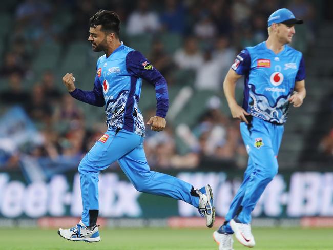 Rashid Khan celebrates after claiming the wicket of Ashton Turner.