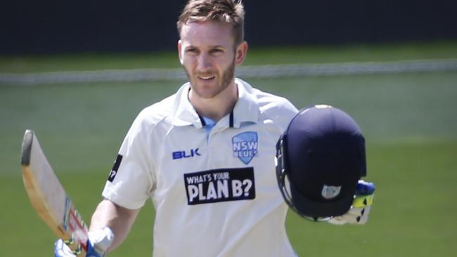 Peter Neville celebrates reaching 100 runs. Picture: KIM EISZELE