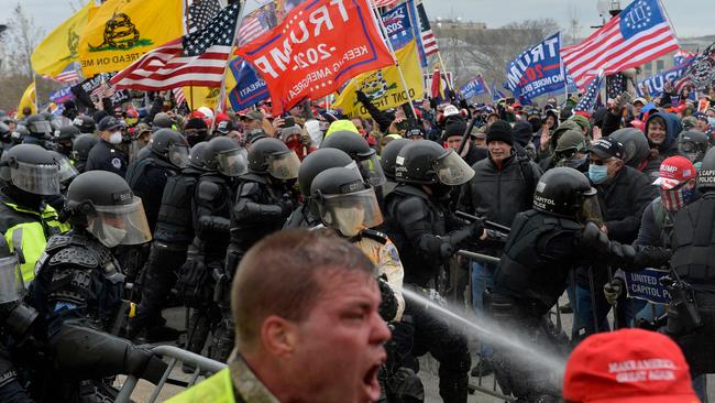Trump supporters clash with police and security forces as they try to storm the US Capitol in Washington on January 6 2021. Picture: AFP.
