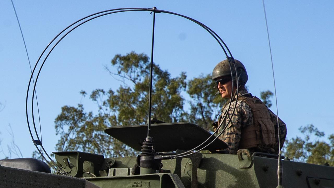 U.S. Marine Corps Cpl. Jonathon Lindgren, a High Mobility Artillery Rocket System section chief with 3d Battalion, 12th Marines, 3d Marine Division, surveys a firing point during Exercise Talisman Sabre 2021 at Shoalwater Bay Training Area, Queensland, Australia, July 15, 2021. TS21 supports the U.S. National Defense Strategy by enhancing our ability to protect the homeland and provide combat-credible forces to address the full range of potential security concerns in the Indo-Pacific. Lindgren is a native of Katy, Texas. (U.S. Marine Corps photo by Lance Cpl. Ujian Gosun)