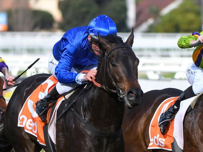 MELBOURNE, AUSTRALIA - AUGUST 14: Damien Oliver riding Ingratiating defeats General Beau in race 6, the Neds Vain Stakes, during Melbourne Racing at Caulfield Racecourse on August 14, 2021 in Melbourne, Australia. (Photo by Vince Caligiuri/Getty Images)