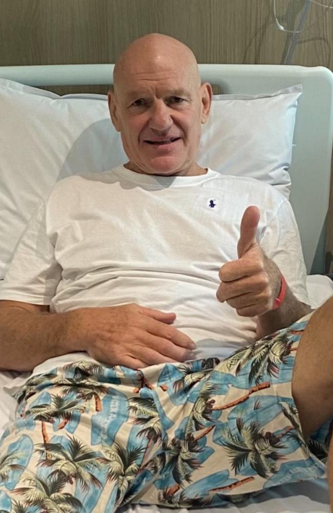 Parramatta Eels legend Peter Wynn gives a thumbs up from his hospital bed.