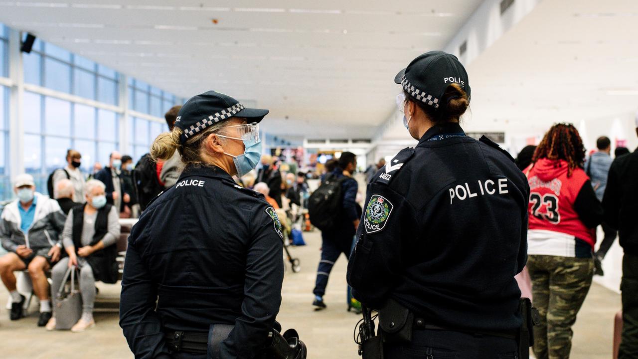 Police presence at arrivals in Adelaide Airport after SA announces a border closure to NT, WA, QLD and the ACT in Adelaide. Picture: Morgan Sette