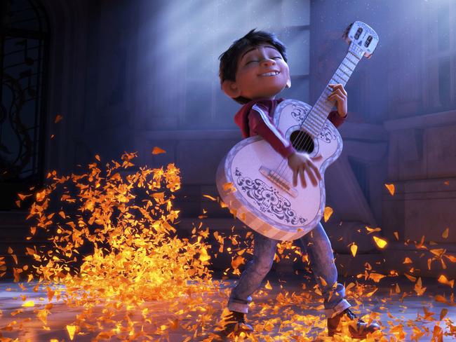 This image released by Disney-Pixar shows characters Miguel, voiced by Anthony Gonzalez in a scene from the animated film, "Coco." (Disney-Pixar via AP)