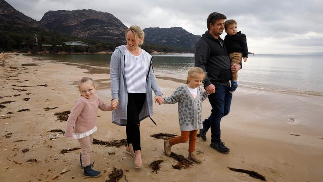 Angela and Daniel Longey, with their children Ayla, Sage and Henry, explore Coles Bay on Tasmania’s Freycinet Peninsula. Picture: Peter Mathew