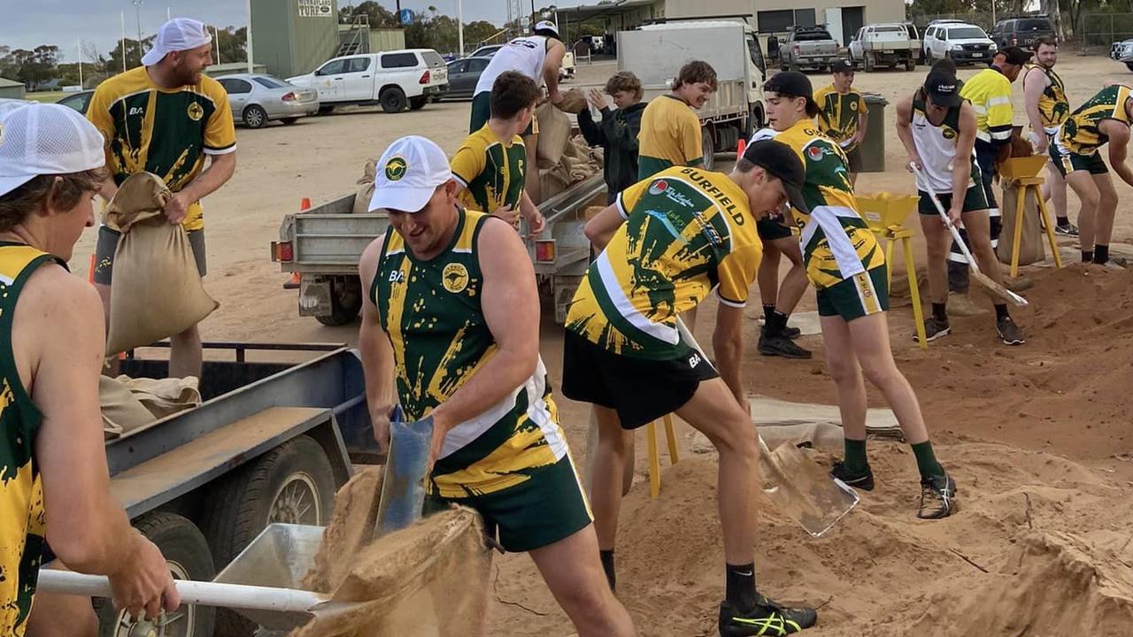 Players from Mannum Football Club filled and delivered sandbags as part of their pre-season training. Picture: Mannum Football Club