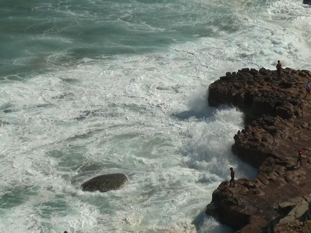 Searchers scour headland at North Avoca. Picture: TNV