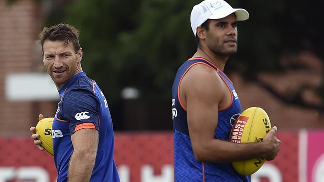 Daniel Wells (right) has set up a number of North Melbourne scores this year. Picture: Andy Brownbill