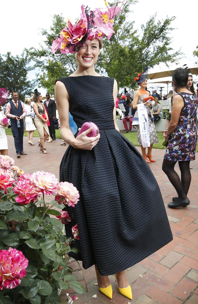 Winner of Melbourne Cup’s Fashions in the Field, Emily Hunter, in a dress made by her mother. Picture: David Caird.