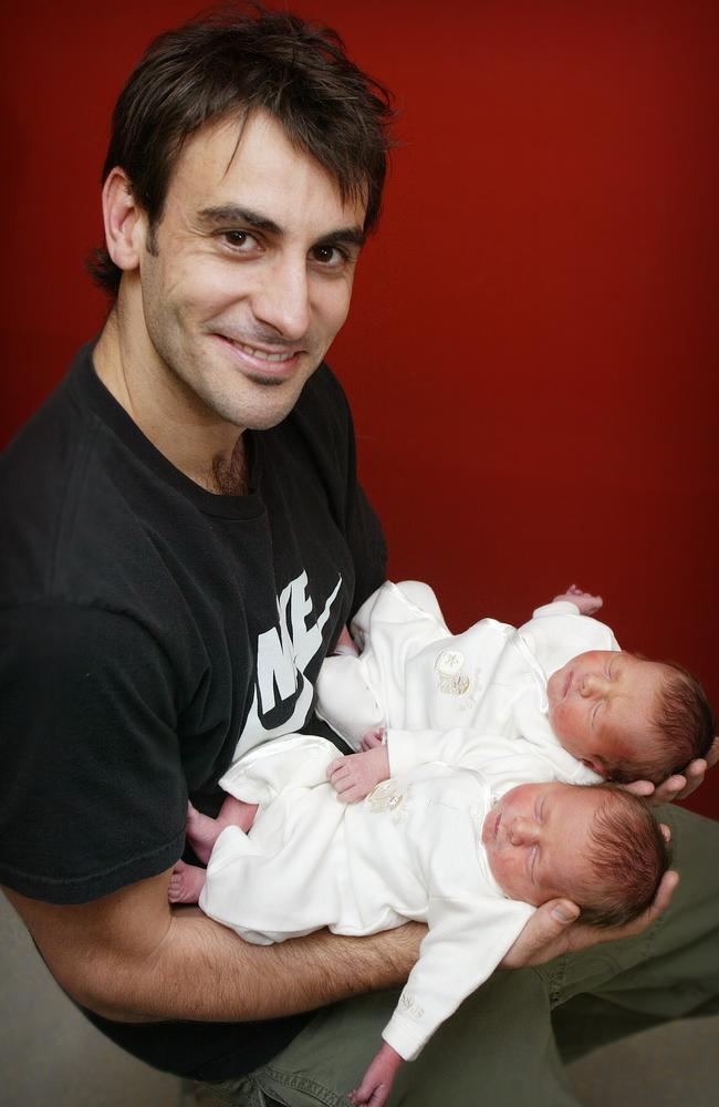 Scott and his infant sons. Over 18 years on, they are both set to be drafted to Carlton.