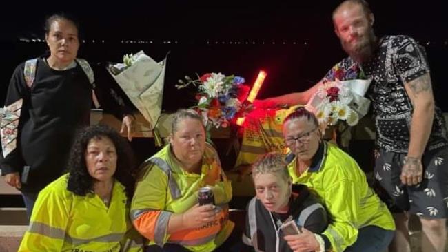 Workmates of Brendan Moreland pay tribute to the popular traffic controller at the site where he died. Back: Mirikia Ahmat and Matthew Wellington. Front: Sharon Ahmat, Deliah Serruerier, Nezzy Falzon and Robyn 'Robbi' Mapley.