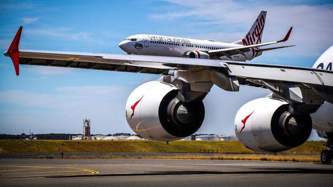 Qantas and Virgin Australia have both had schedules disrupted by air traffic control staff shortages, resulting in airspace restrictions.