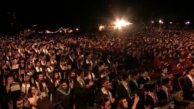 Students give Admiral William H. McRaven a standing ovation.