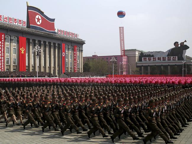 FILE - In this April 15, 2017, file photo, soldiers march across Kim Il Sung Square during a military parade in Pyongyang, North Korea. North Korea is preparing to stage a major event to mark the 70th anniversary of the founding of its military on Feb. 8, 2018 - just one day before the opening ceremony of the Pyeongchang Winter Olympics in South Korea. (AP Photo/Wong Maye-E, File)