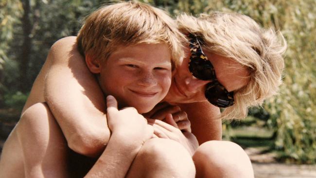 An undated picture of the late Diana, Princess of Wales, embracing Prince Harry while on holiday. Harry wrote that she was “hunted” to her death in his memoir, Spare. Picture: AFP