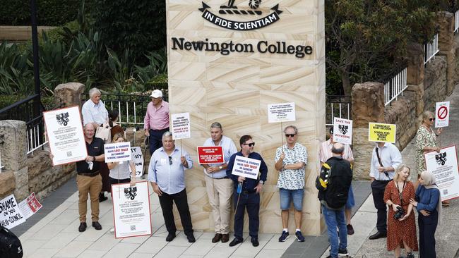 DAILY TELEGRAPH 31ST JANUARY 2024Pictured in Stanmore outside Newington College as boys arrive for their first day of the new school year, are parents with placards during a silent protest against the proposed switch to Newington College becoming a co-ed school.Picture: Richard Dobson