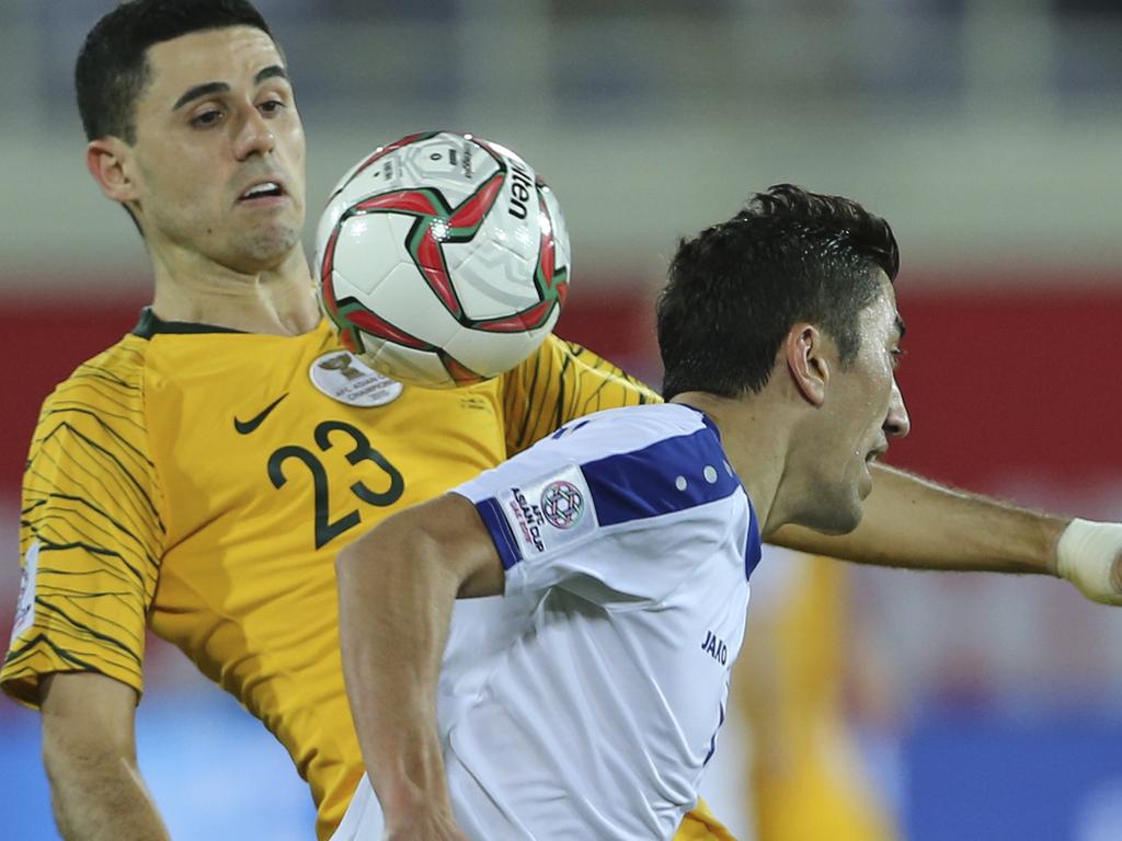 Australia's midfielder Tomas Rogic, left, controls the ball against Uzbekistan's midfielder Odil Ahmedov during the AFC Asian Cup round of 16 soccer match between Australia and Uzbekistan at the Khalifa bin Zayed Stadium in Al Ain, United Arab Emirates, Monday, Jan. 21, 2019. (AP Photo/Kamran Jebreili)