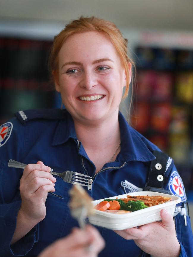 Paramedic Jessie Fraser tucks into lunch. Picture: Angelo Velardo