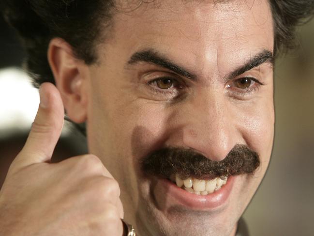 Actor Sacha Baron Cohen arrives in character as Borat Sagdiyev for the film premiere of 'Borat: Cultural Learnings of America for Make Benefit Glorious Nation of Kazakhstan" in Los Angeles, Oct. 23, 2006. - headshot smiling thumbs /up