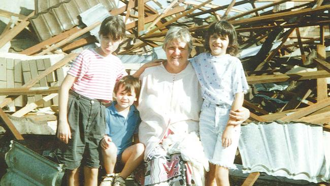 Lexly Black with her grandchildren,(from left) Kylie Holzberger and Michael and Belinda Black after the 1992 Bucca tornado. Family X-rays were found in the bush 4km away.