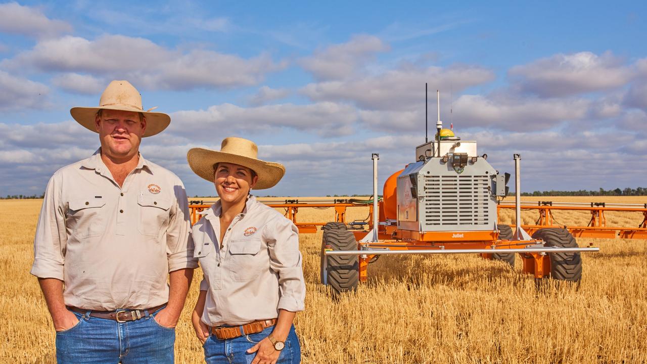 Co Founder of SwarmFarm Robotics, (left), and one of the company's robots.