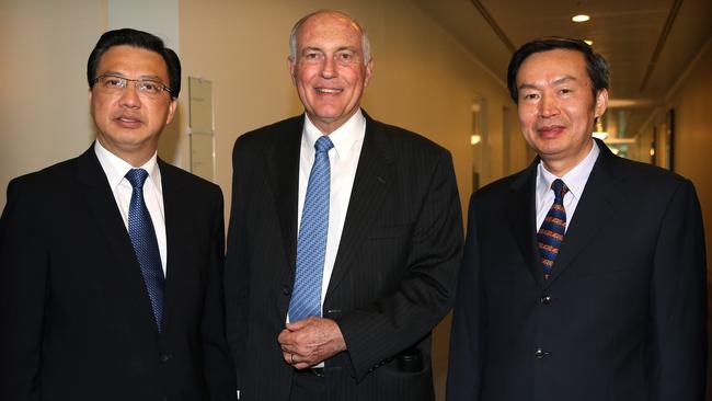 Deputy Prime Minister and Minister for Infrastructure and Regional Development, Warren Truss, Malaysian Transport Minister DatoÕ Sri Liow Tiong Lai and Chinese Vice-Minister of Transport He Jianzhong after holding a press conference on MH370 at Parliament House in Canberra.