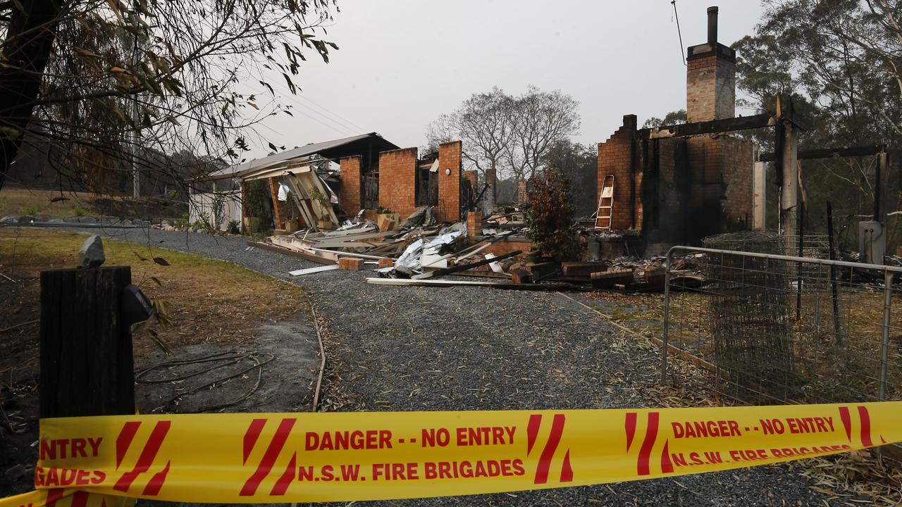 A home destroyed by bushfire in Koorainghat, south of Taree in NSW, on Monday. Picture: AAP