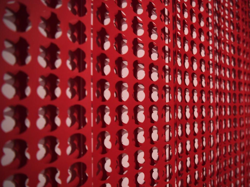 The large-scale installation titled 'War Room' by British artist Cornelia Parker to commemorate the lives lost during World War I and subsequent wars at the Museum of Contemporary Art in Sydney, Friday, November 8, 2019. War Room is made from perforated paper negatives left over from production of remembrance poppies. (AAP Image/Dean Lewins) NO ARCHIVING