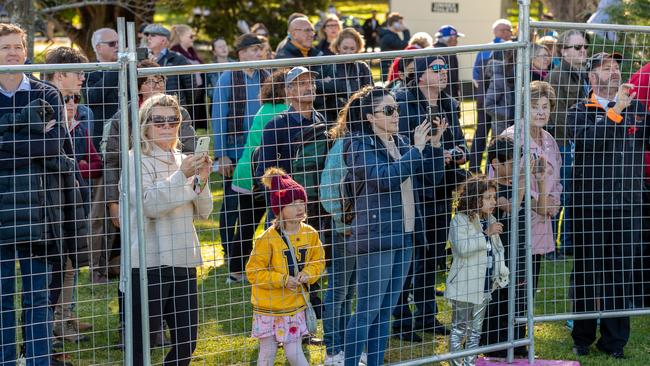 Families watch the Anzac Day March behind a wired fence at the Shrine of Remembrance. Picture: Asanka Ratnayake/Getty Images