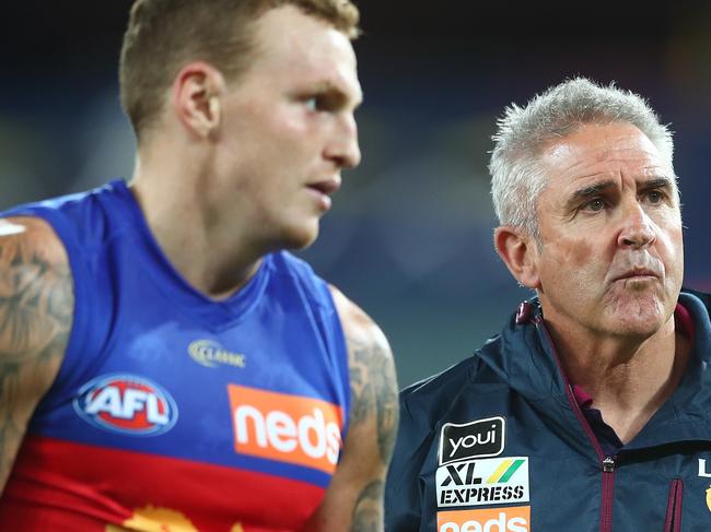 GOLD COAST, AUSTRALIA - JULY 26: Lions head coach Chris Fagan talks to Mitch Robinson of the Lions after winning the round 8 AFL match between the Melbourne Demons and the Brisbane Lions at Metricon Stadium on July 26, 2020 in Gold Coast, Australia. (Photo by Chris Hyde/Getty Images)