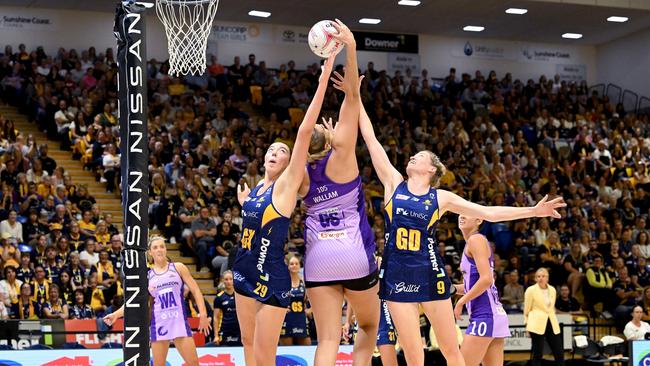 Ashleigh Ervin and Karla Pretorius of the Lightning challenge for the ball against Donnell Wallam of the Firebirds. Photo: Getty Images