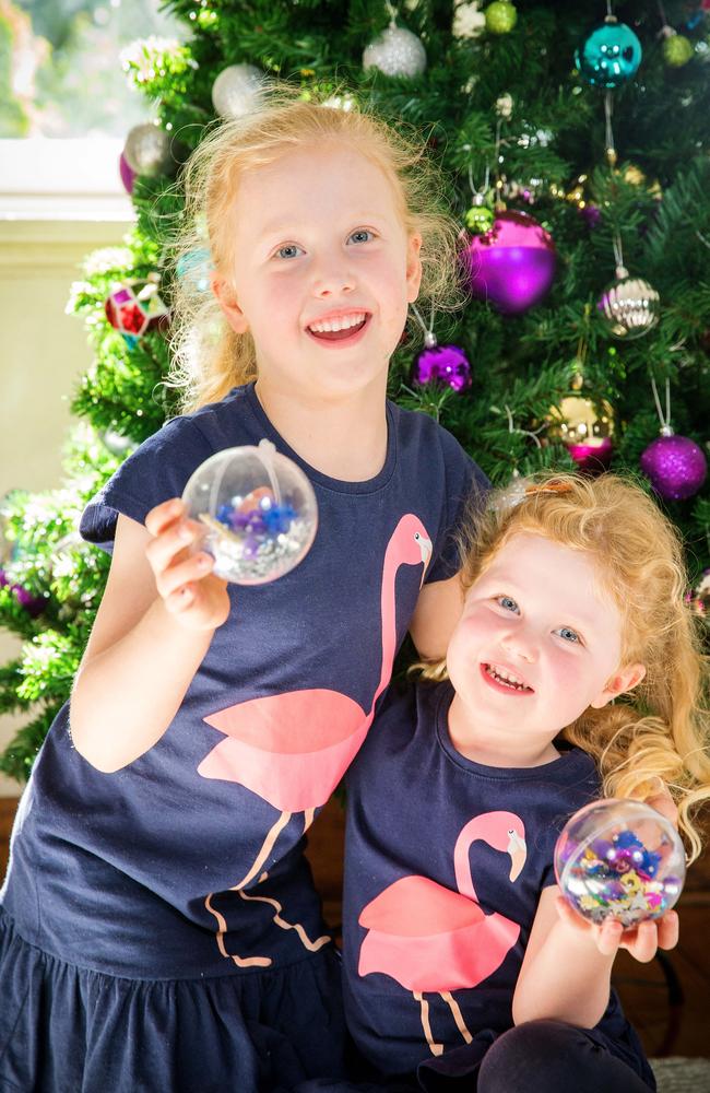 Annabel, 6, and Sophie, 3, prepare baubles. Picture: Mark Stewart