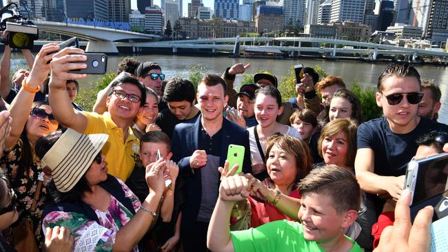 New WBO welterweight champion Jeff Horn poses for selfies with fans in Brisbane.