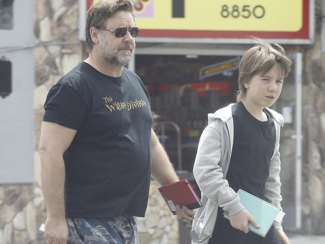 Crowe out and about with his son Charlie. Picture: Splash News