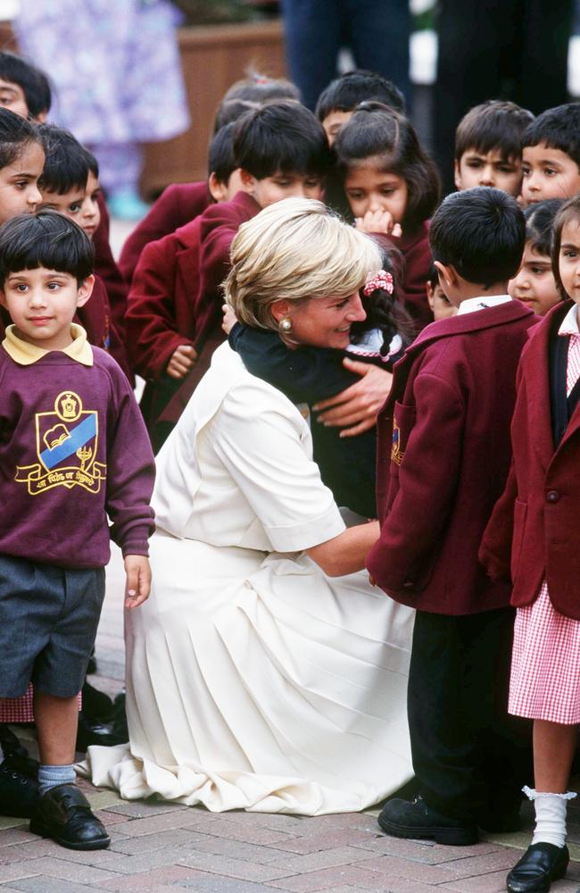 Diana hugs a child during her visit to Shri Swaminarayan Mandir Hindu Temple on June 6, 1997 in London. Picture: Anwar Hussein