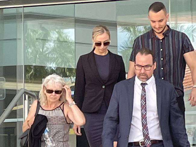 Former Queensland Police Service officer Kirra-Lee Currell, 27, (blonde hair in dark attire) pleaded guilty to two misconduct charges where she told her then-boyfriend Cameron Grant Blewitt he was on police radar for dealing cocaine and illegally possessing weapons. Pictured leaving Rockhampton courthouse with her mother (front left), then Currell, then her fiance and her lawyer Calvin Gnech in front.