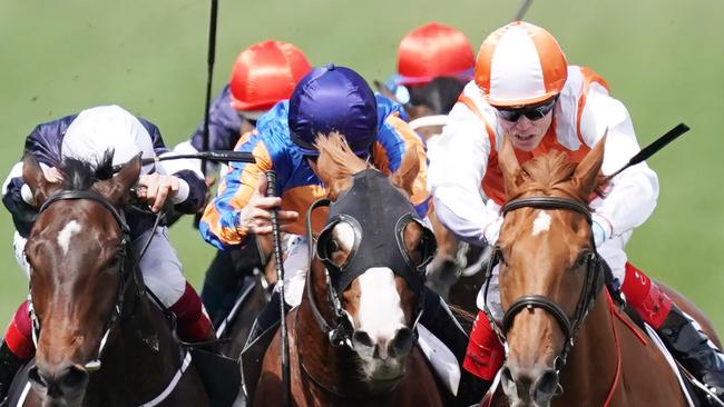 Jockey Craig Williams rides Vow And Declare (Right) to victory against Frankie Dettori riding Master Of Reality and Jockey Michael Walker riding Prince Of Arran in race 7, the Lexus Melbourne Cup, during Melbourne Cup the Lexus Melbourne Day, at Flemington Racecourse in Melbourne, Tuesday, November 5, 2019. (AAP Image/Michael Dodge) NO ARCHIVING, EDITORIAL USE ONLY