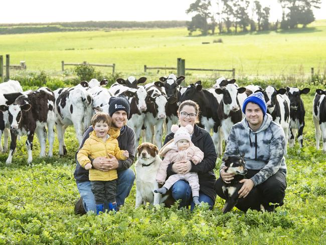 Peter and Marnie with their children alongside dairy worker Alistair Huth. Picture: Zoe Phillips