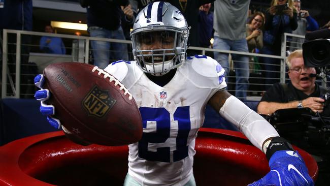 Ezekiel Elliott #21 of the Dallas Cowboys celebrates after scoring a touchdown.