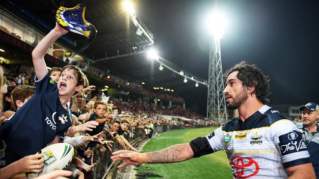 North Queensland Cowboys Johnathan Thurston give his headgear to a young fan Cohen Jarrett, 9, who made his way up from Katherine with his family to see his star, JT, following the Cowboys win over the Parramatta Eels at TIO on Saturday night. Picture: Justin Kennedy